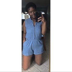 Denim Romper with gold bottoms.